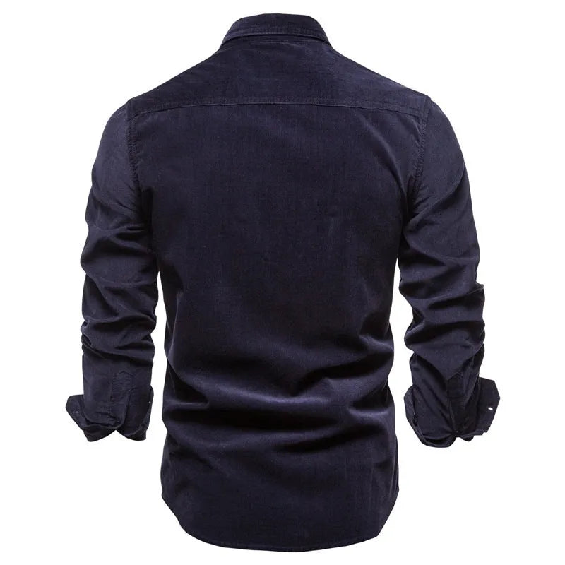 Men's denim blue long sleeve linen shirt laid flat, showing button front and long sleeves.