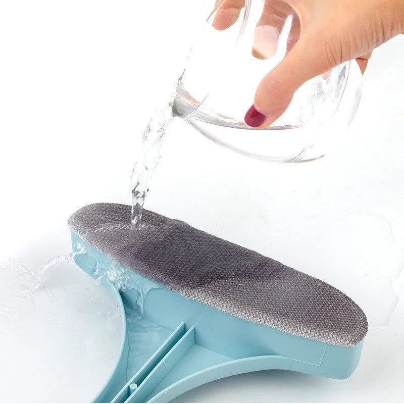 Blue and pink window screen cleaning brush with detachable crevice brush on a white background