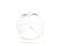 Soft knitted baby bonnet for newborns and toddlers in a solid colour on a mannequin head