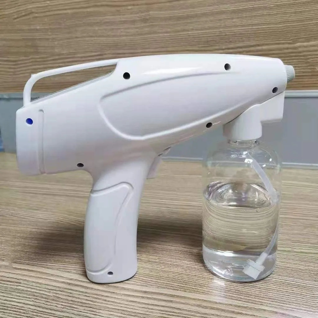 White handheld cordless electric spray gun with USB-C charging port on display