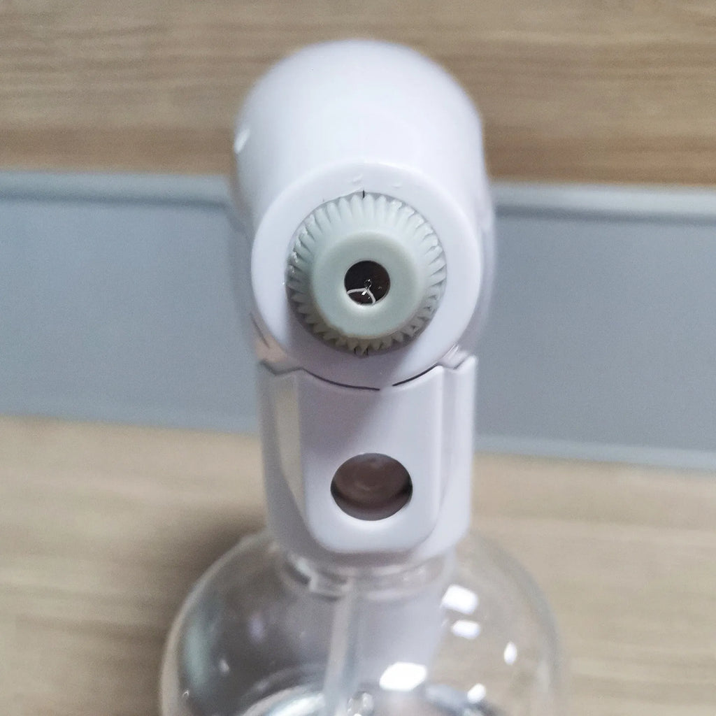 White handheld cordless electric spray gun with USB-C charging port on display