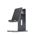 Alloy mobile phone holder bracket on desktop in dark space gray colour holding smartphone