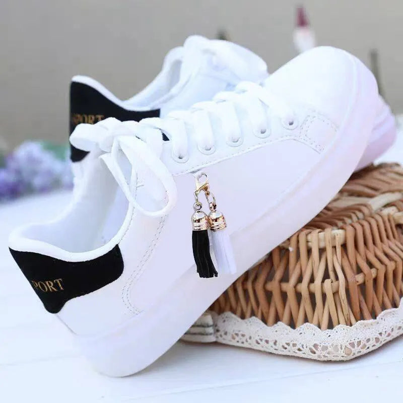 White mesh women's casual sneakers with flat rubber sole and breathable lining on a solid background.