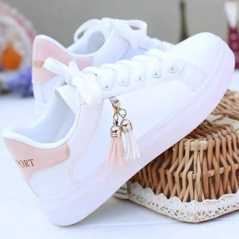 White mesh women's casual sneakers with flat rubber sole and breathable lining on a solid background.