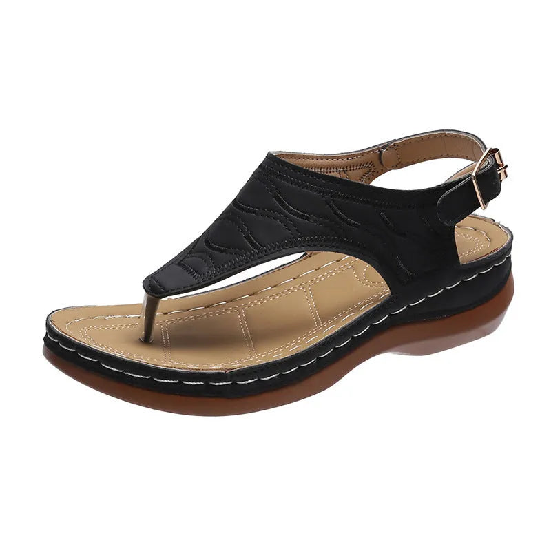Women's casual wedge-heel sandals with adjustable buckle strap in a solid colour.