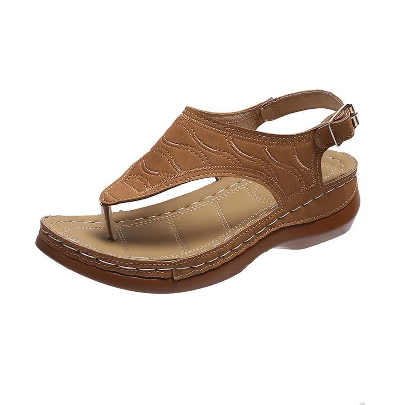 Women's casual wedge-heel sandals with adjustable buckle strap in a solid colour.