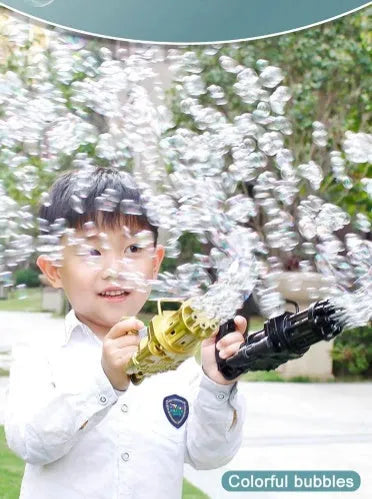 Child holding a pink, gold, or black ABS plastic bubble machine gun toy blowing bubbles.
