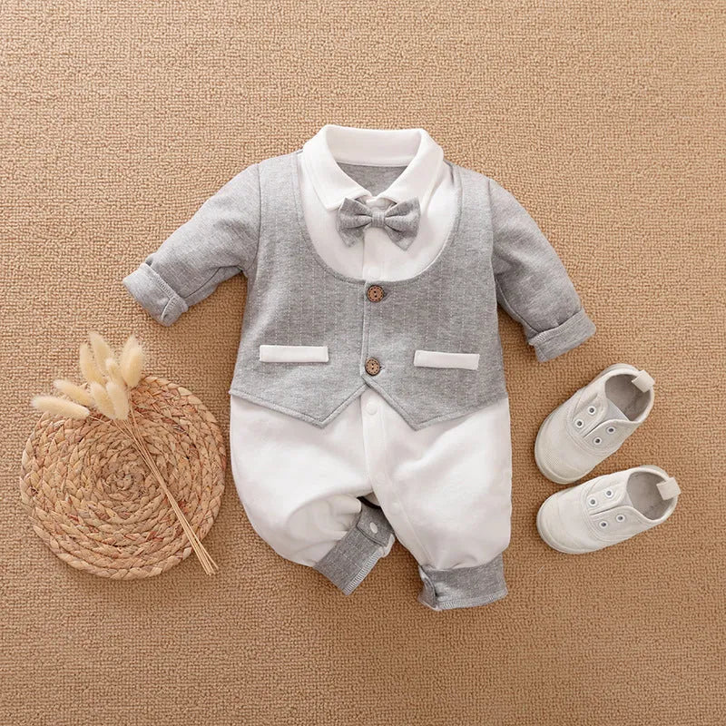 Baby boy in a long-sleeved cotton jumpsuit, gentleman style, for spring or autumn.