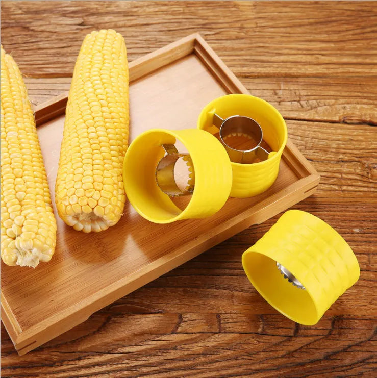 Yellow manual corn grinder thresher with corn-shaped PP handle and stainless steel gear.