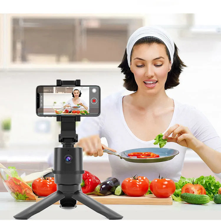 Intelligent AI tracking pan tilt camera bracket mounted on a selfie pole, holding a smartphone.