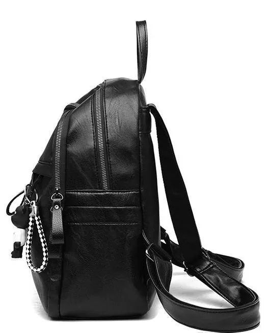 Black medium-size PU leather soft surface backpack with double straps and a zipper opening