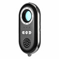 Compact black wireless anti-theft alarm detector for travel security with vibration sensor.