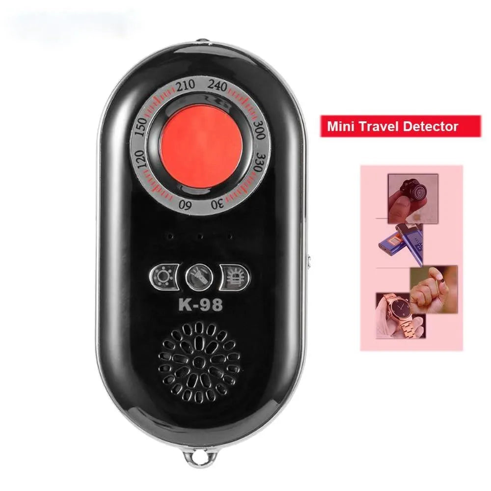 Compact black wireless anti-theft alarm detector for travel security with vibration sensor.