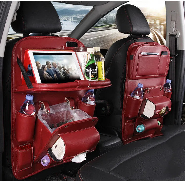 PU leather car seat back storage organiser with multiple pockets hanging on a car seat.