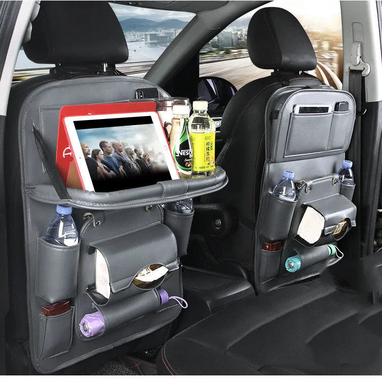 PU leather car seat back storage organiser with multiple pockets hanging on a car seat.