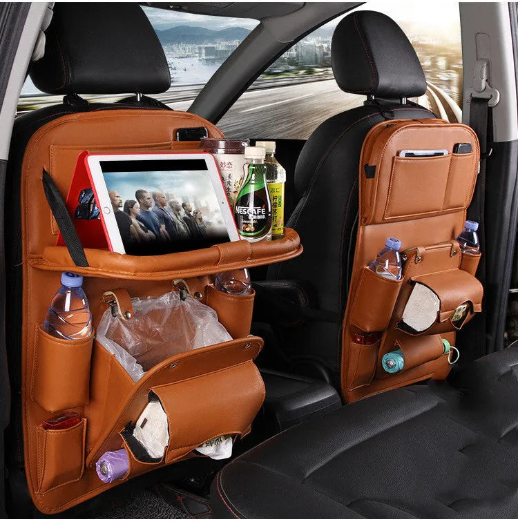 PU leather car seat back storage organiser with multiple pockets hanging on a car seat.