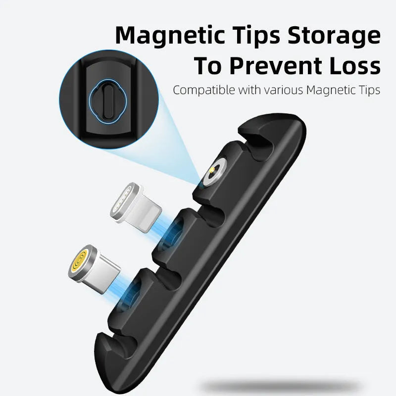Black desktop magnetic cable organiser with soft plastic base on a desk.