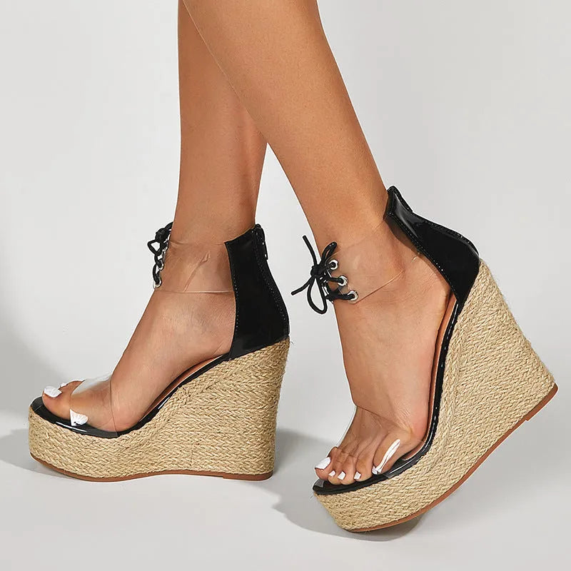 Black women's wedge sandals with hemp rope detail on platform sole and front tie closure