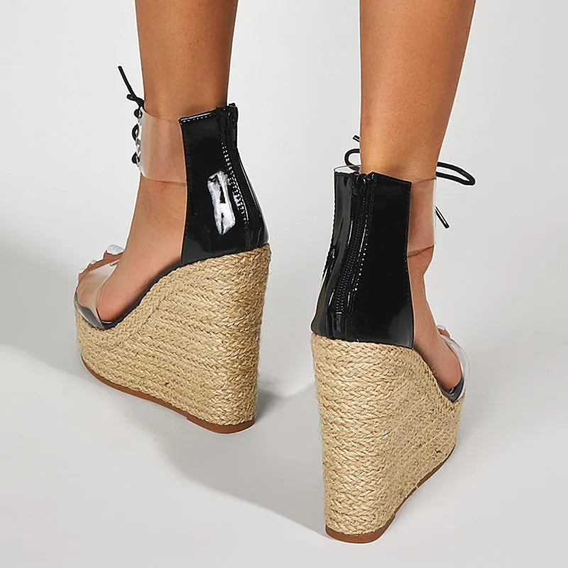 Black women's wedge sandals with hemp rope detail on platform sole and front tie closure