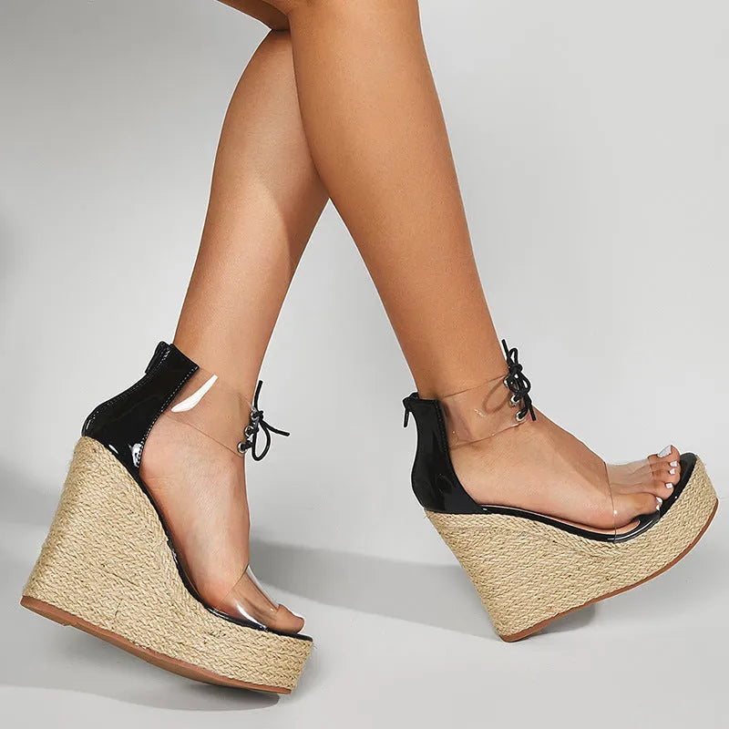 Black women's wedge sandals with hemp rope detail on platform sole and front tie closure