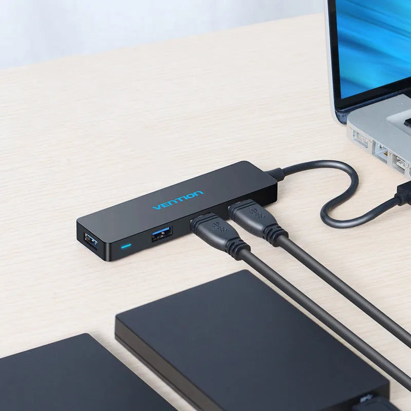 Black USB 3.0 hub with four ports and 0.15 metre cable