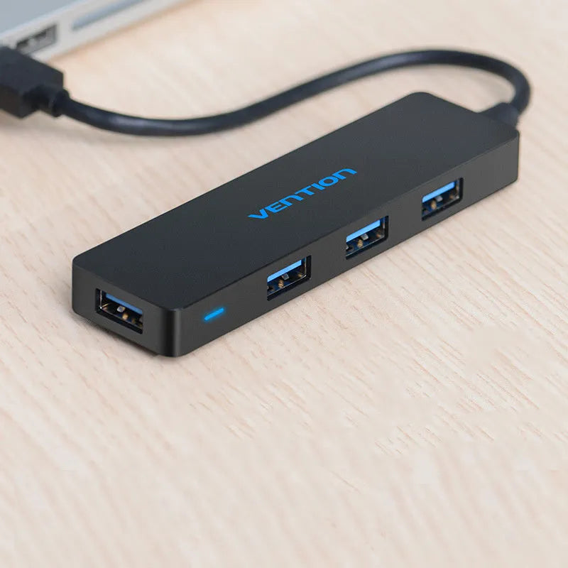 Black USB 3.0 hub with four ports and 0.15 metre cable