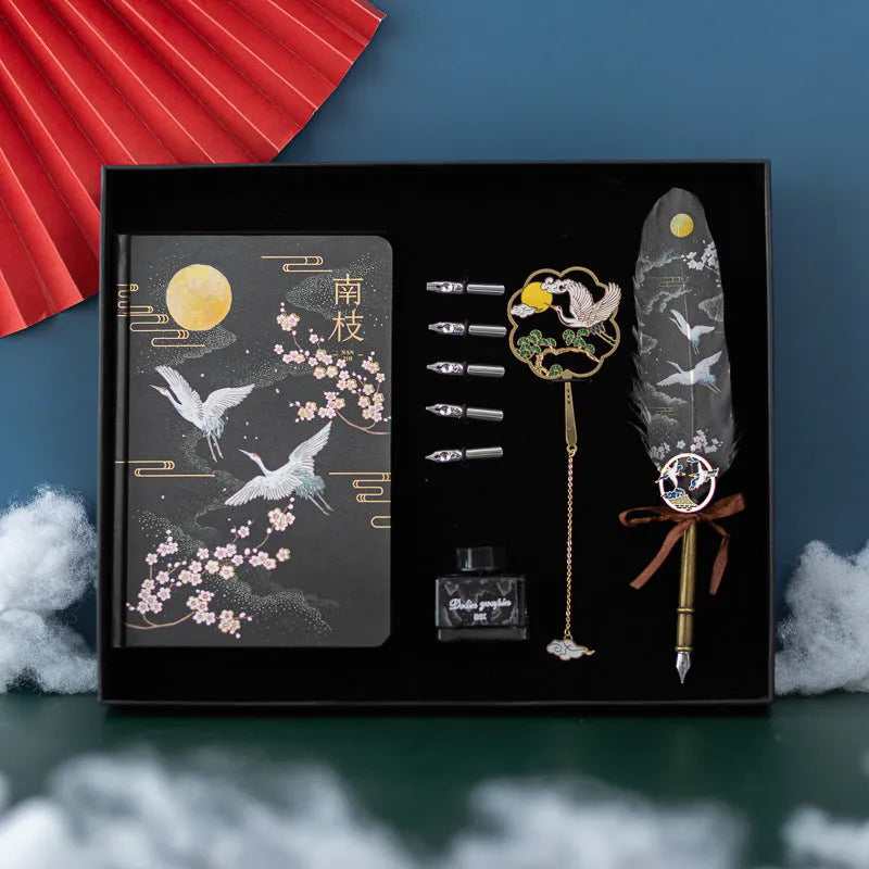 Chinese style feather pen and Jianhegui notebook set in a metal gift case with coloured feathers.