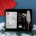 Chinese style feather pen and Jianhegui notebook set in a metal gift case with coloured feathers.