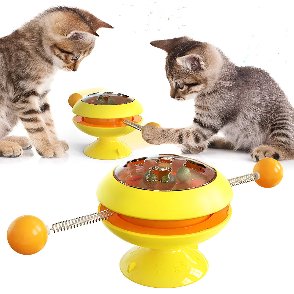 Rotatable plastic cat toy with catnip balls in a transparent top and a large suction cup base, shown in lake blue.