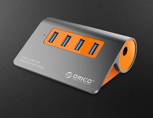 Dark grey and orange aluminium USB hub with 4 ports, separate power unit, and 100cm cable