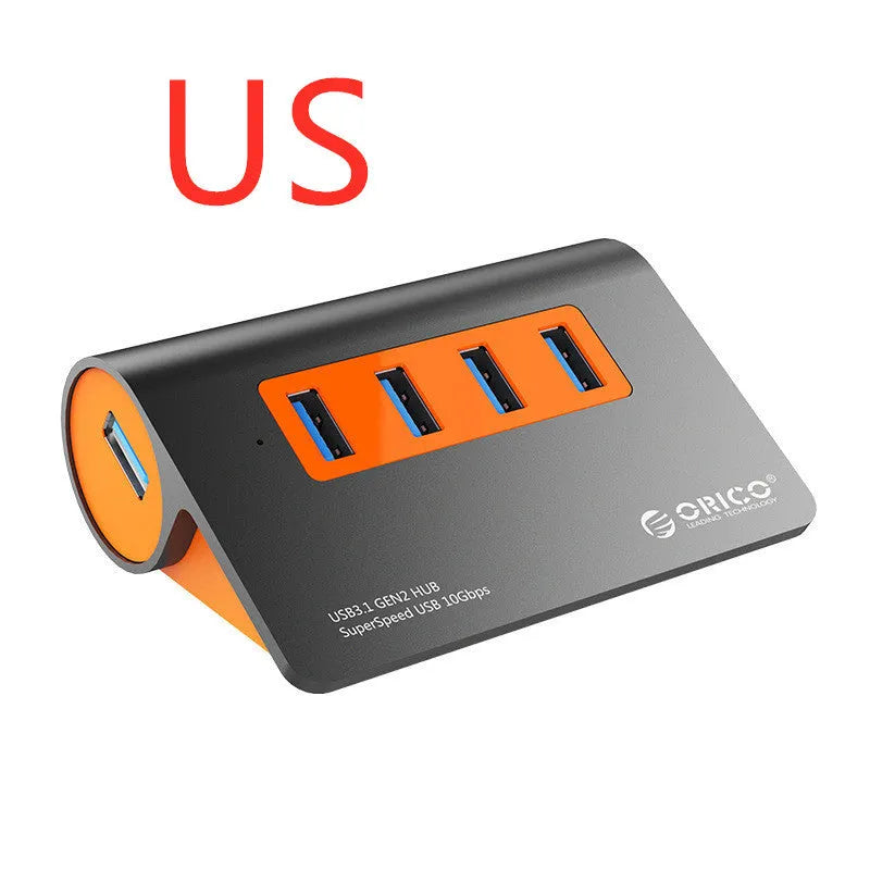 Dark grey and orange aluminium USB hub with 4 ports, separate power unit, and 100cm cable