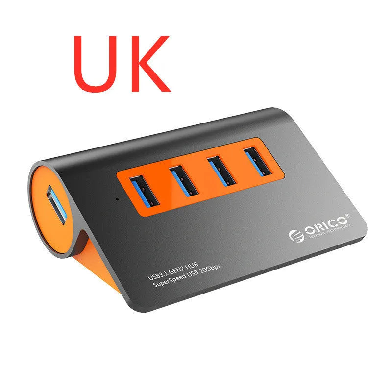 Dark grey and orange aluminium USB hub with 4 ports, separate power unit, and 100cm cable