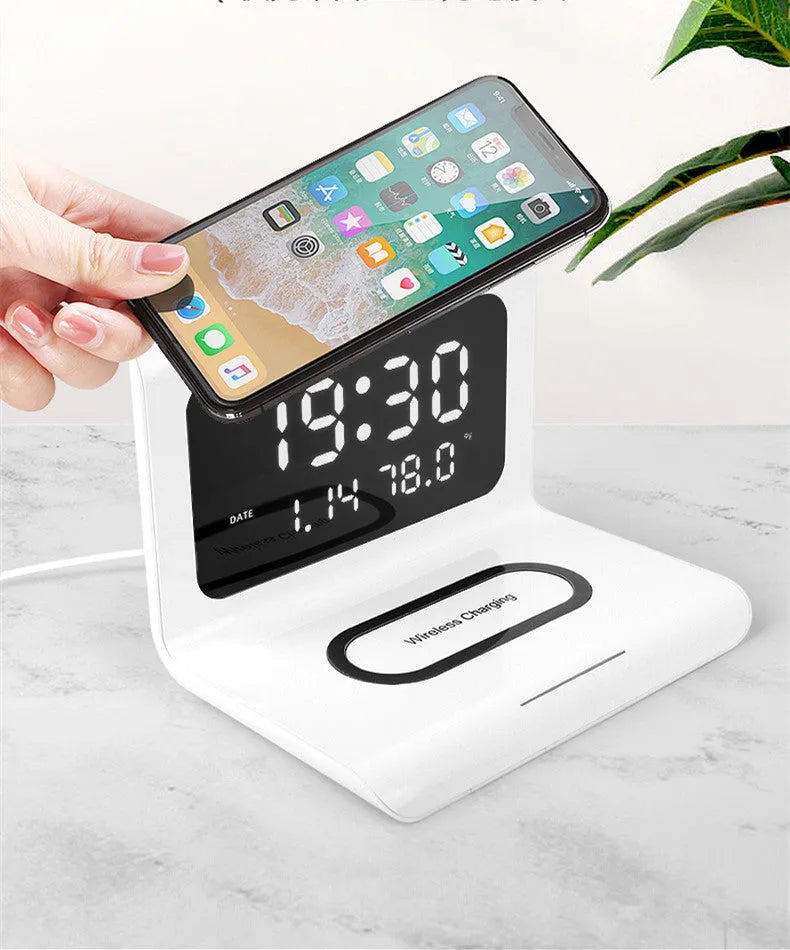 White wireless charger alarm clock showing time, date, temperature and humidity on display