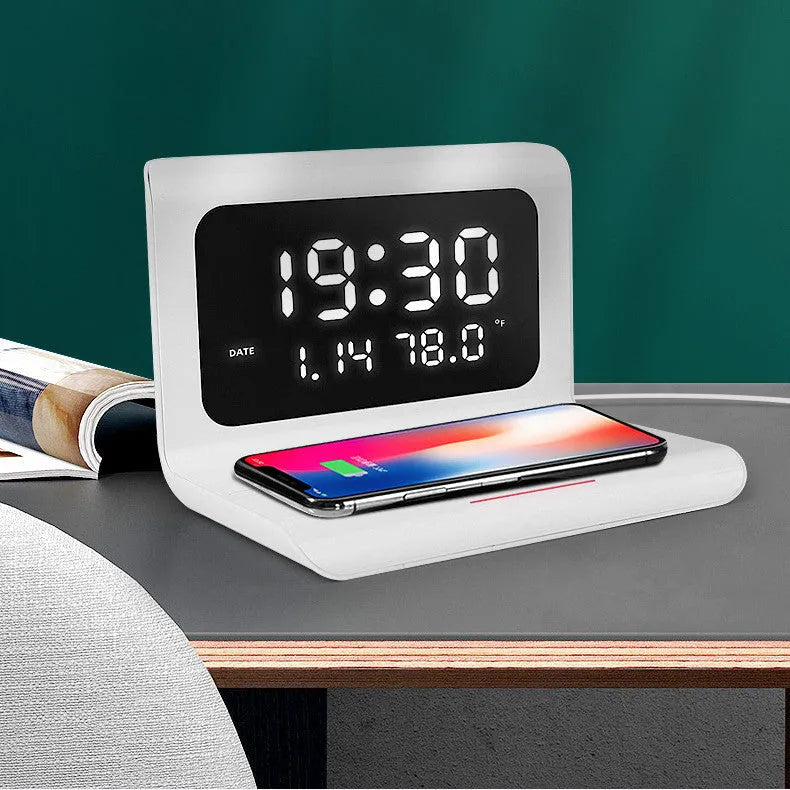 White wireless charger alarm clock showing time, date, temperature and humidity on display