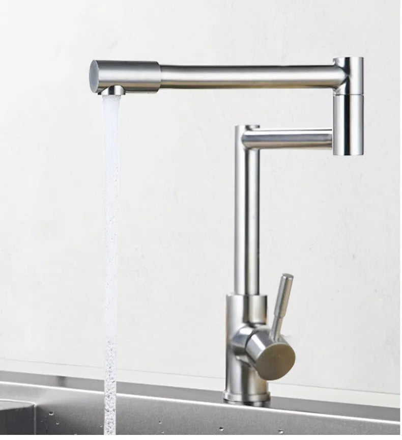 Silver stainless steel dual-handle kitchen faucet with a rotating spout.