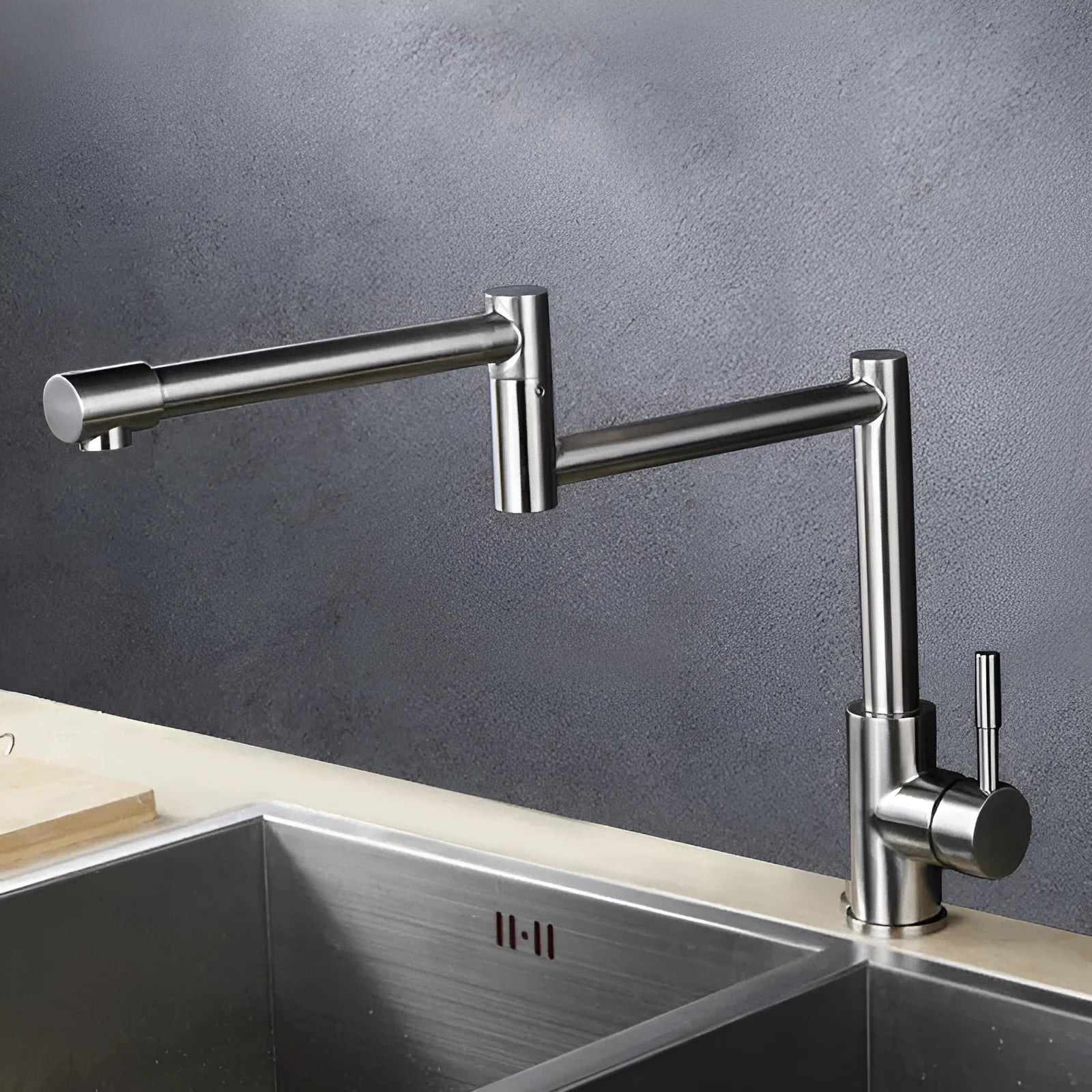 Silver stainless steel dual-handle kitchen faucet with a rotating spout.