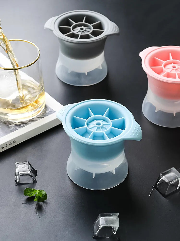 Silicone ice tray showing hockey puck, sphere, round and pentagon ice mould shapes in various colours