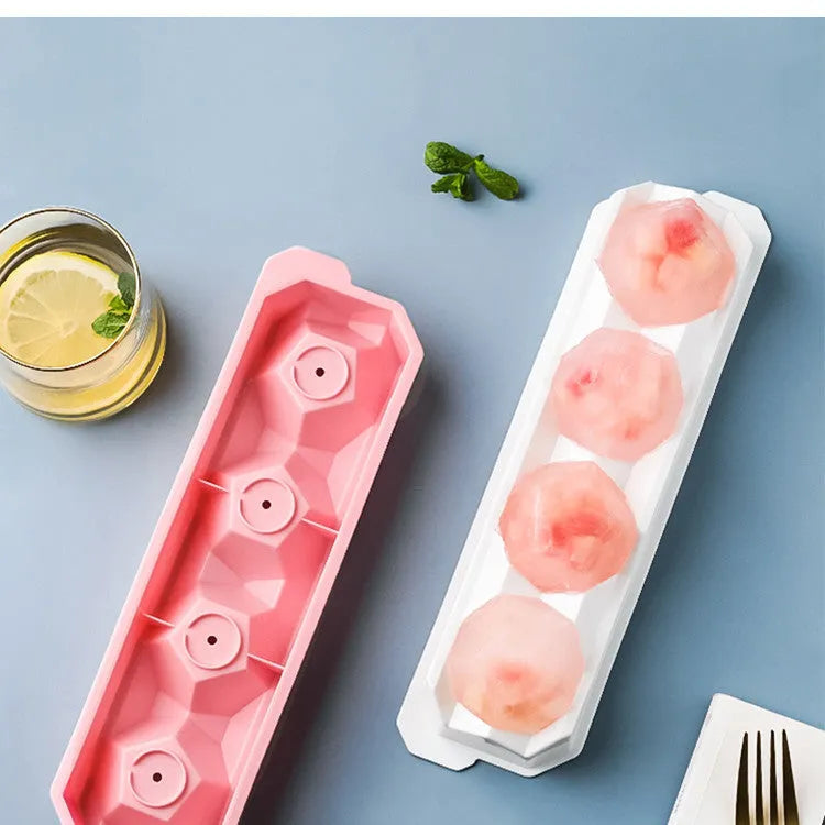 Silicone ice tray showing hockey puck, sphere, round and pentagon ice mould shapes in various colours