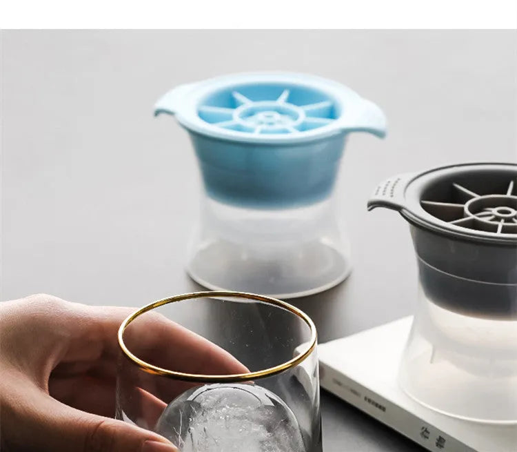 Silicone ice tray showing hockey puck, sphere, round and pentagon ice mould shapes in various colours