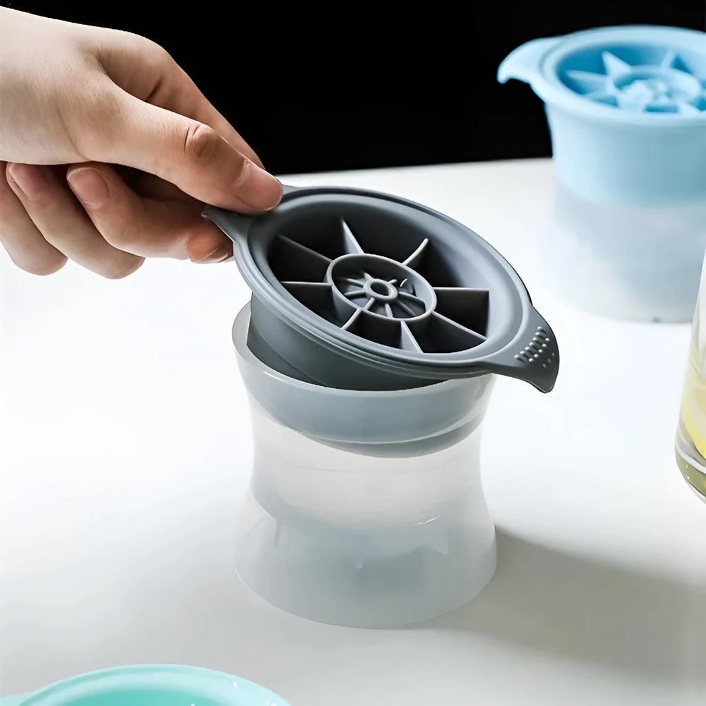 Silicone ice tray showing hockey puck, sphere, round and pentagon ice mould shapes in various colours