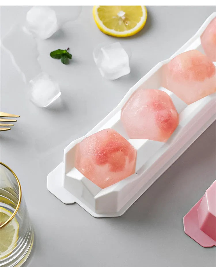 Silicone ice tray showing hockey puck, sphere, round and pentagon ice mould shapes in various colours