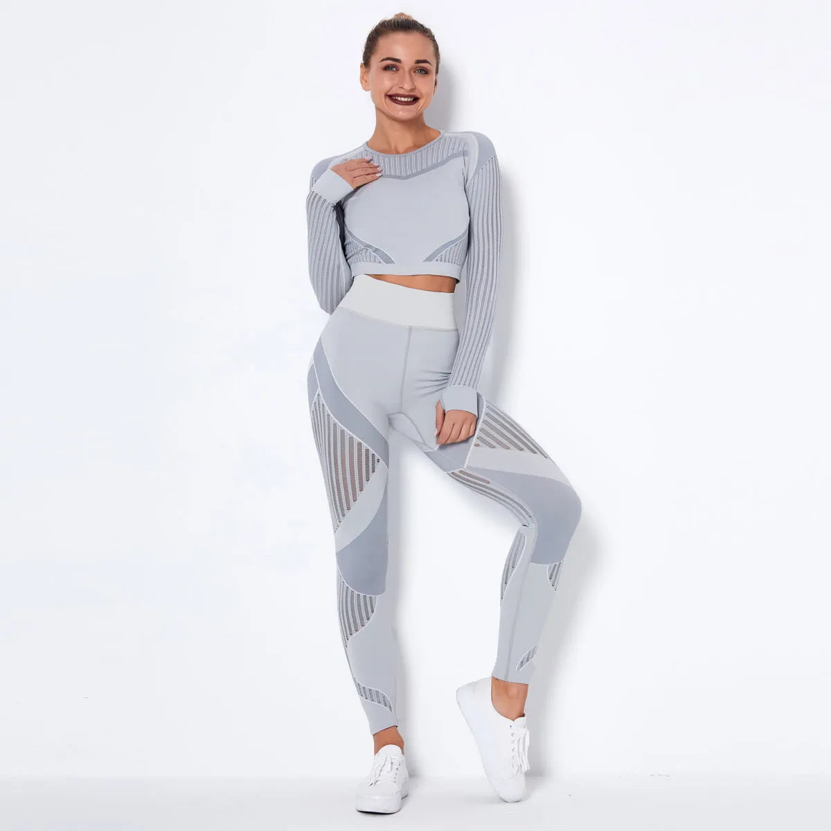 Women's long-sleeved seamless knitted yoga suit in a breathable fabric blend.