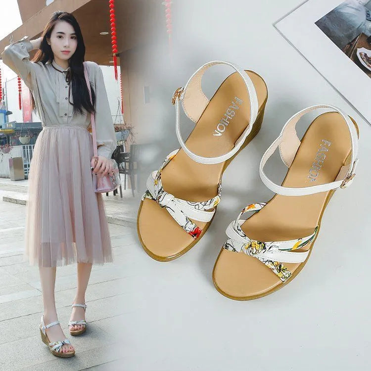 Women's pink wedge sandals with a thick heel, fish mouth design, and a one-shaped buckle.