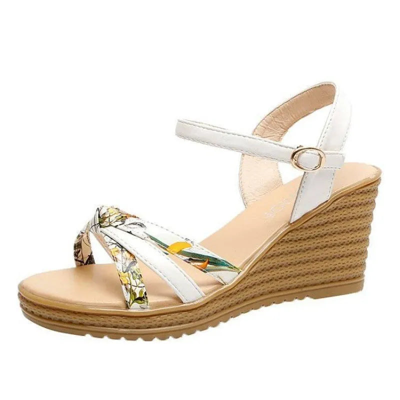 Women's pink wedge sandals with a thick heel, fish mouth design, and a one-shaped buckle.