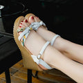 Women's pink wedge sandals with a thick heel, fish mouth design, and a one-shaped buckle.