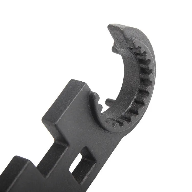 Black all-steel combination wrench for AR15 and M4 rifle maintenance on a plain background.