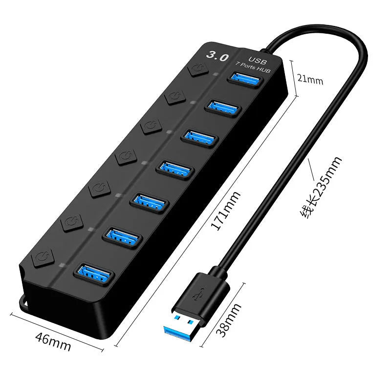 Black 7-port USB 3.0 hub with external power adapter on a desk.