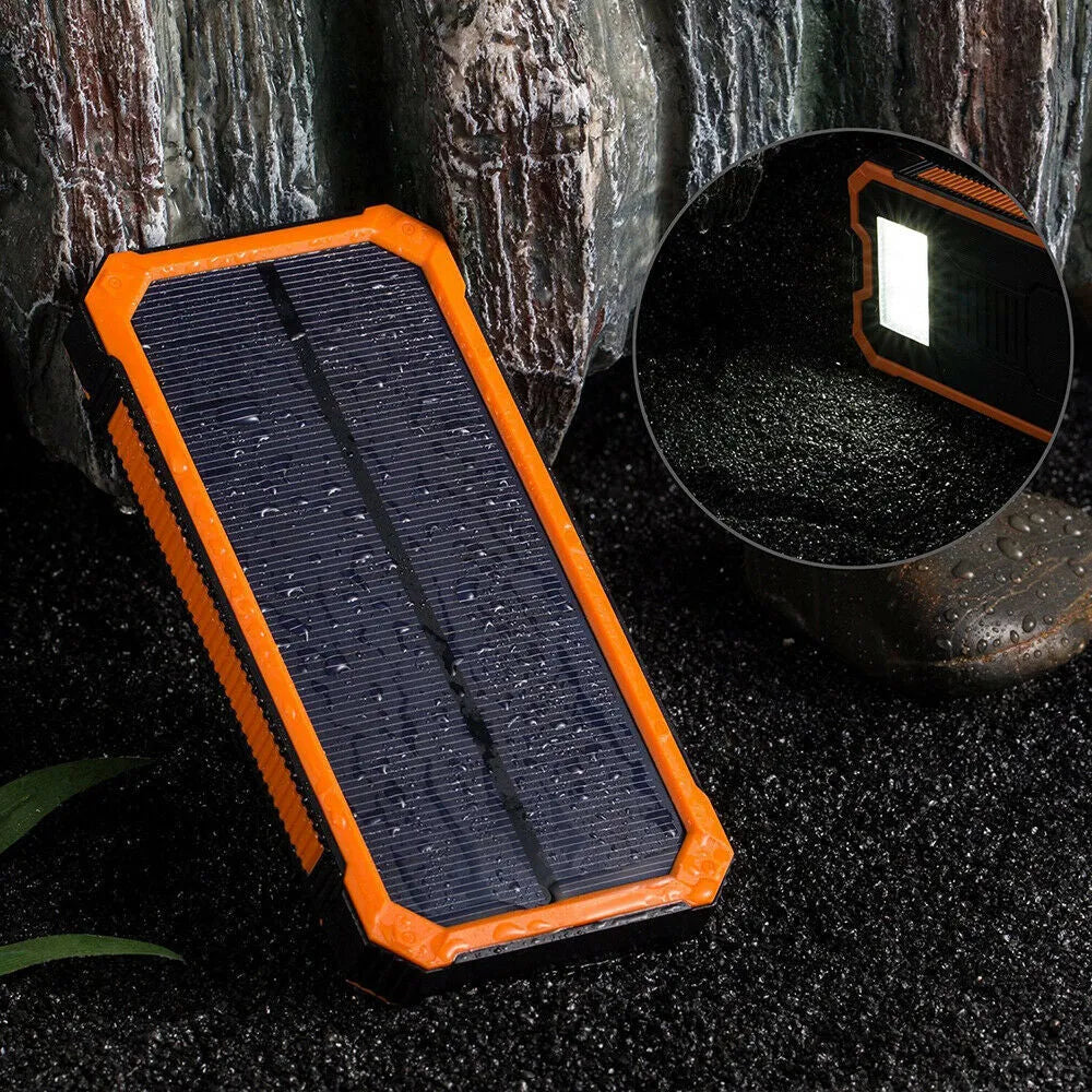 Orange solar power bank with 20000mAh capacity showing USB ports and solar panel