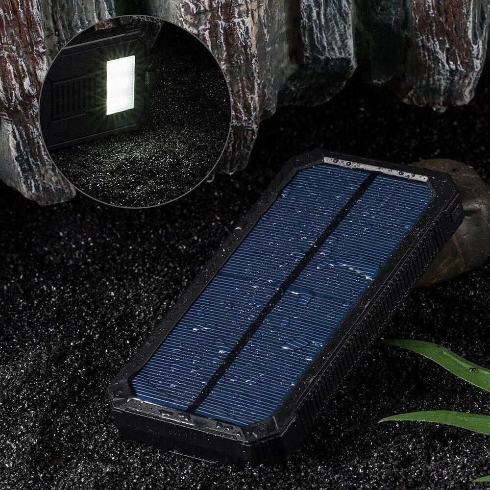 Orange solar power bank with 20000mAh capacity showing USB ports and solar panel
