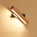 Modern wooden adjustable LED wall lamp with lighting bar in black or white finish.